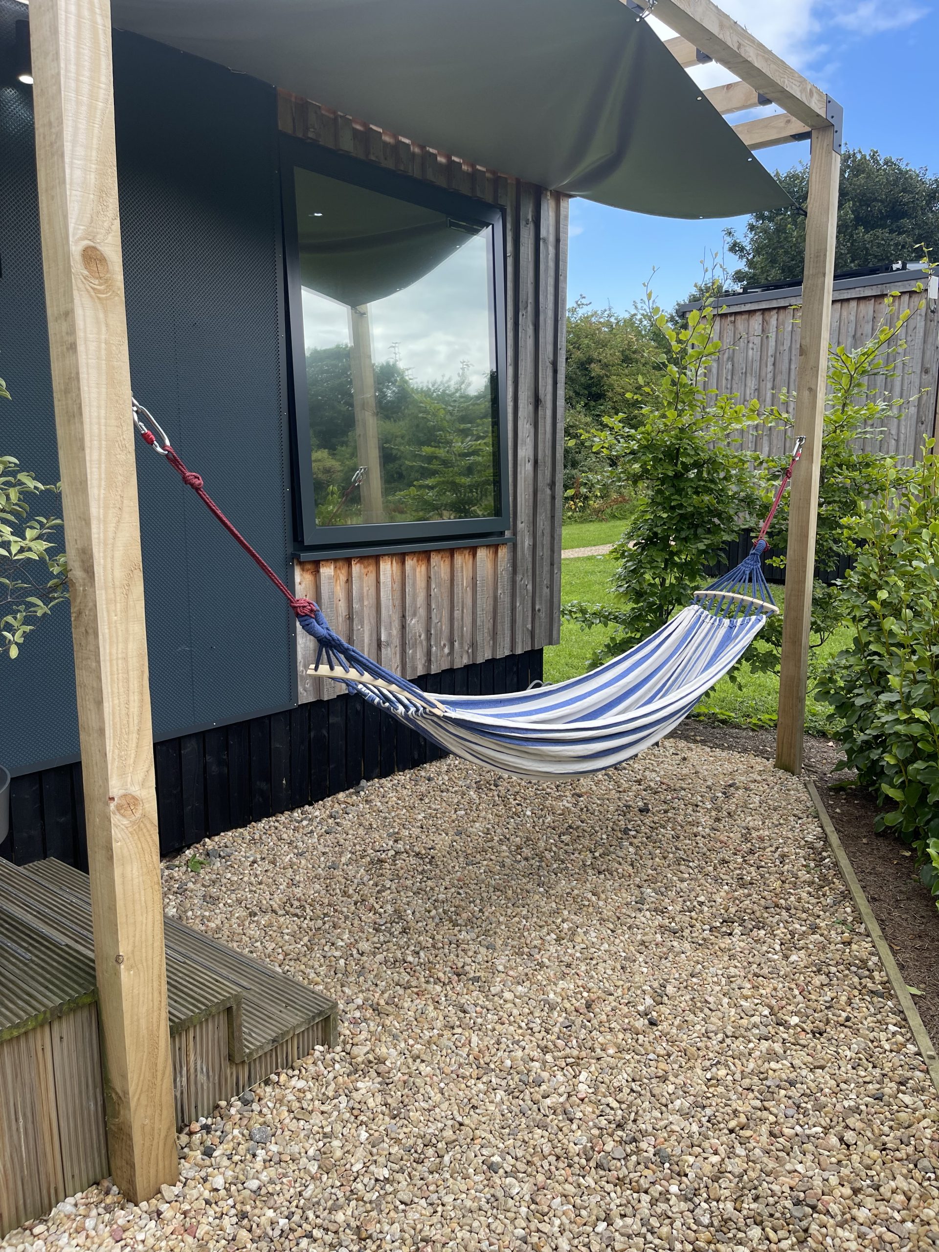 cabin with hot tub and hammock